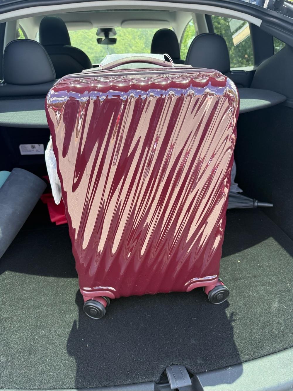 Tumi Glossy Wine Red Carry-On Spinner